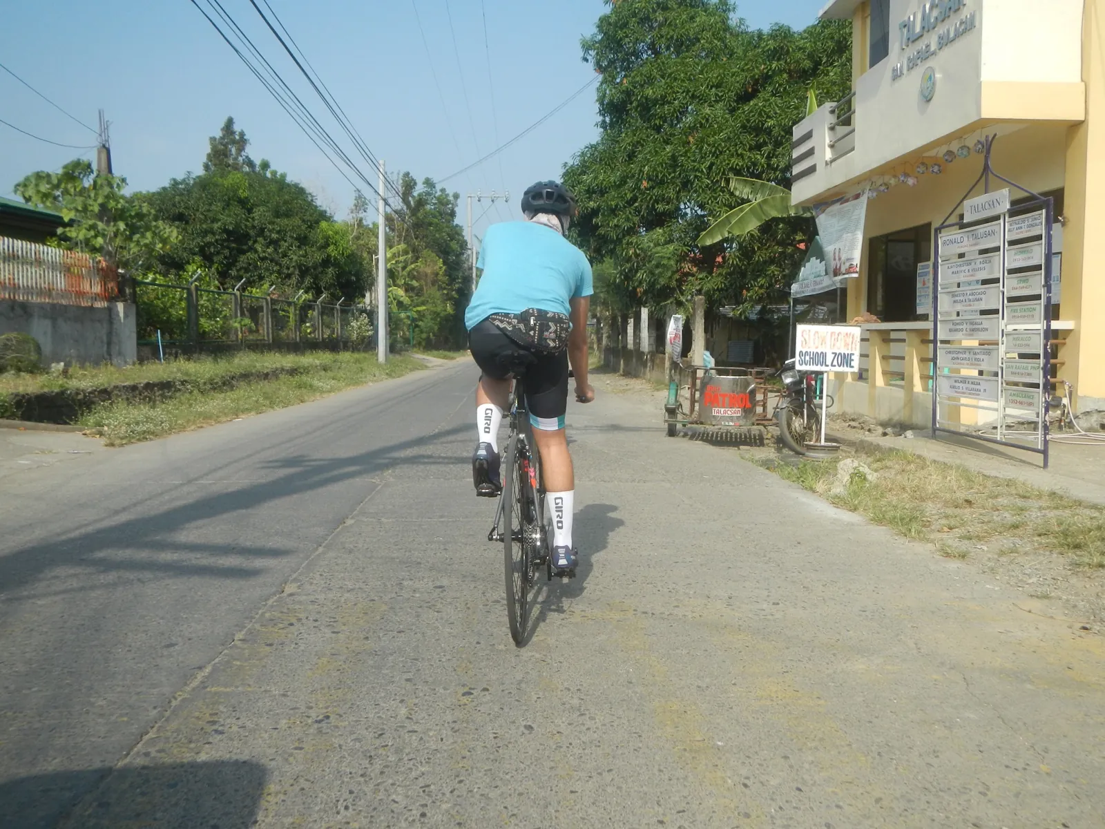 Road cyclists riding with helmets