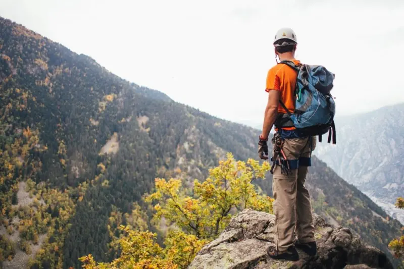 Hiker with a backpack on a mountain