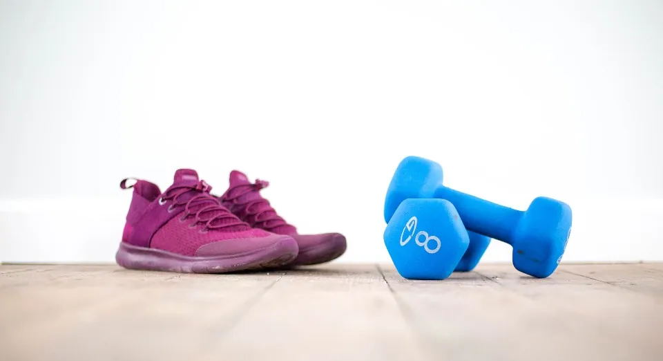 Training sneakers and dumbbells